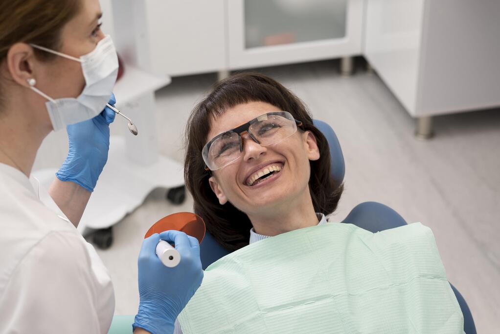 female-patient-having-procedure-done-dentist.jpg